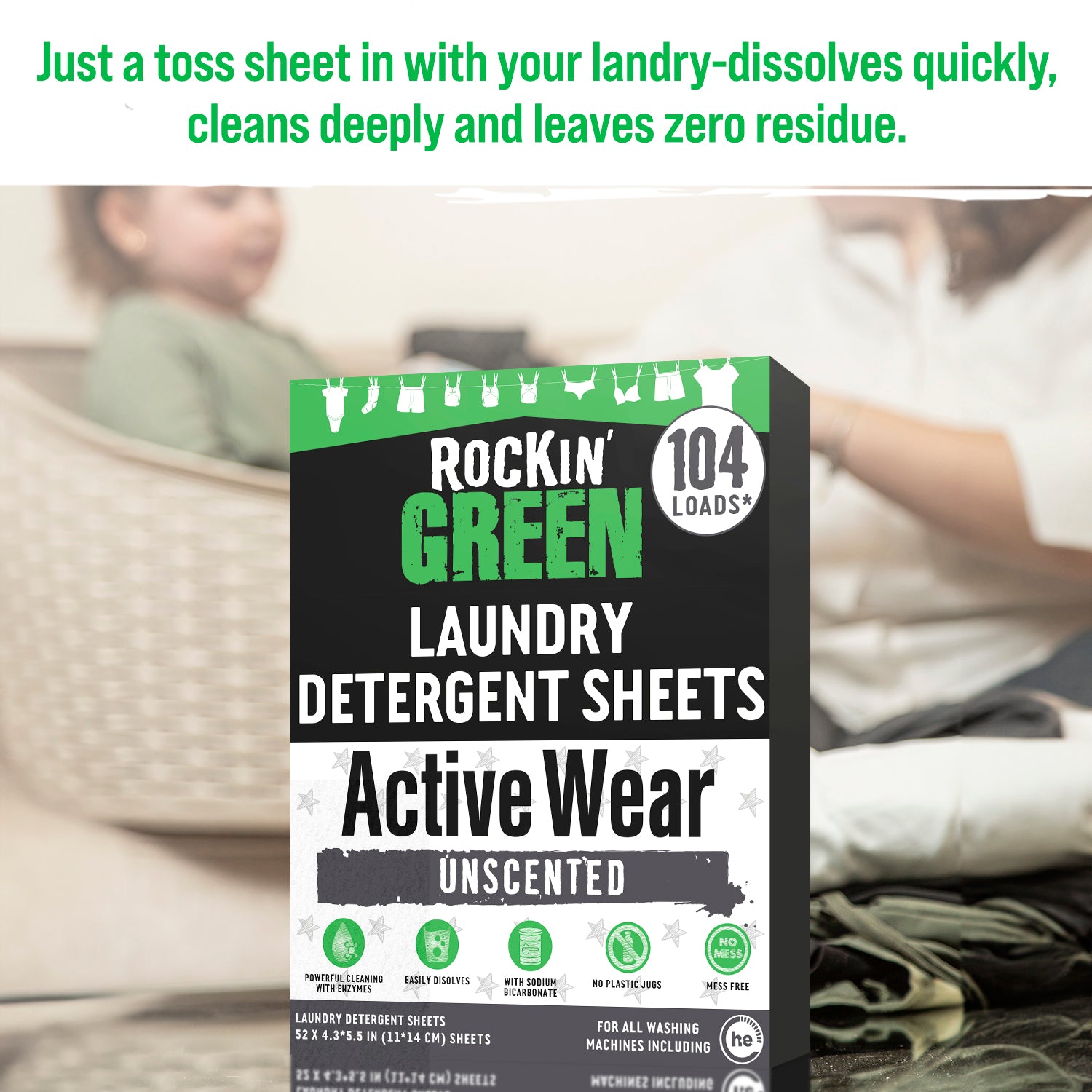 Rockin Green Active Wear Laundry Detergent Sheets, with people folding laundry in the background.