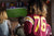 Sports Fan Jersey on Woman Watching Football Game - How to Wash Jerseys with Natural Detergent