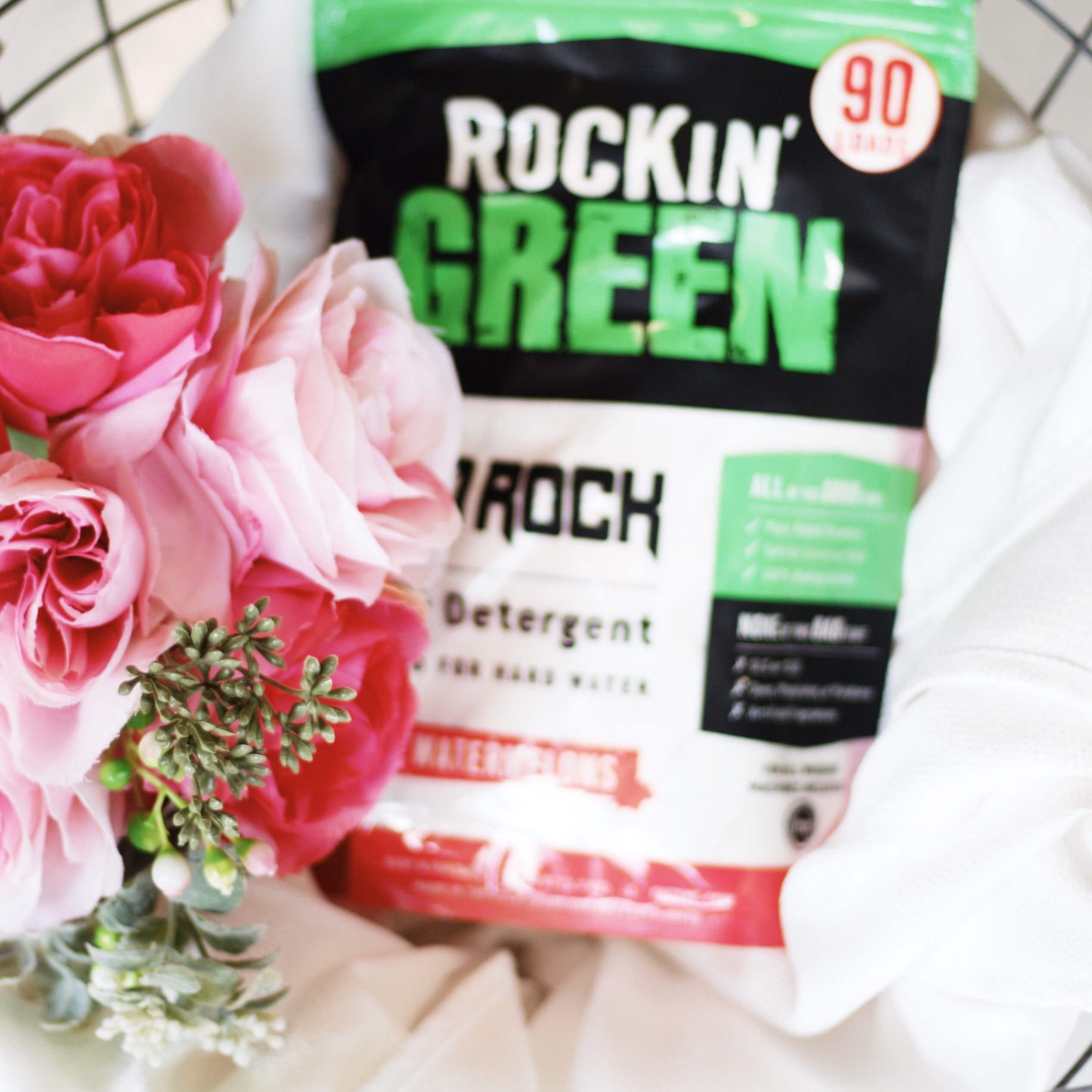 Rockin Greens Hard Rock Detergent with plant power, featuring Smashing Watermelons on a white cloth background.