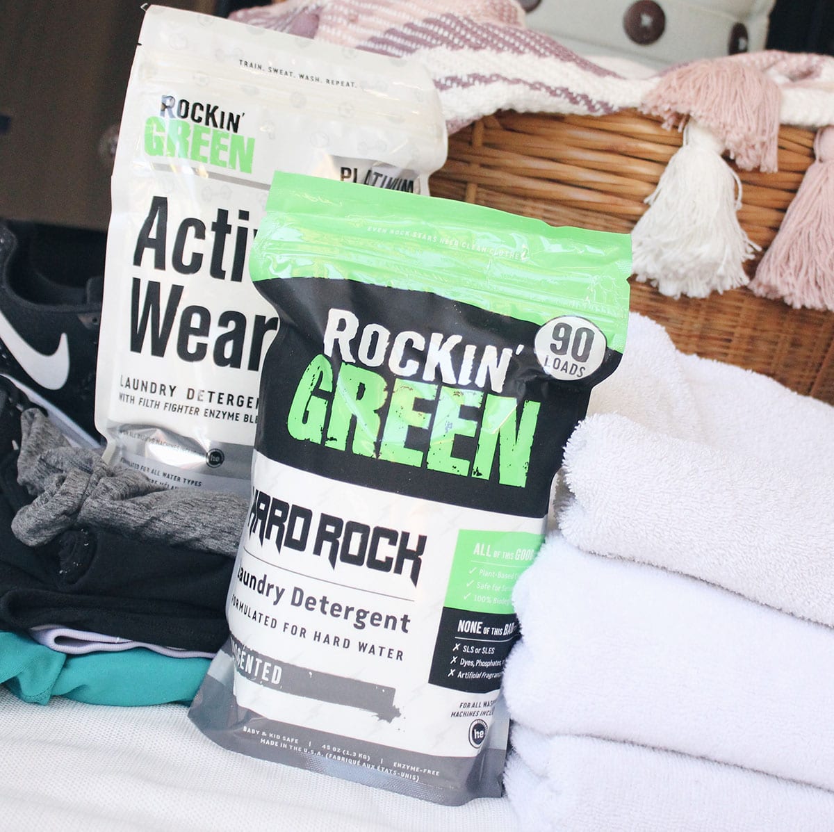 Lets Get Physical for Hard Water Bundle by Rockin Green with folded towels and a laundry basket.